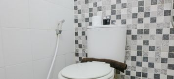 In-room Bathroom 5 2BR Homey at Suites @Metro Apartment By Travelio