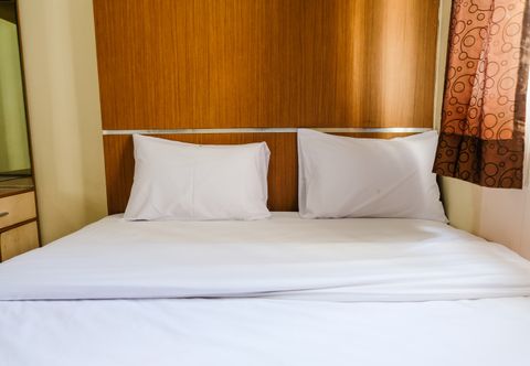 Bedroom 2BR Homey at Suites @Metro Apartment By Travelio