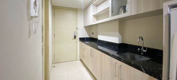 Common Space 2 Elegant and Nice Studio Apartment at Warhol (W/R) Residence By Travelio