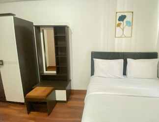 Kamar Tidur 2 Homey and Modern Look 1BR Signature Park Grande Apartment By Travelio