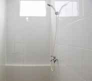 In-room Bathroom 6 Stay Cozy 3BR Bassura City Apartment near Mall By Travelio