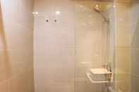 In-room Bathroom Stay Cozy Studio at 27th Floor Daan Mogot City Apartment By Travelio