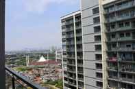 Bangunan Stay Cozy Studio at 27th Floor Daan Mogot City Apartment By Travelio