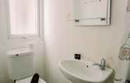 In-room Bathroom 3 Cozy and Warm Studio Apartment (No Kitchen) Aeropolis Residence By Travelio