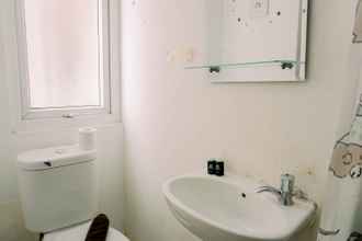 In-room Bathroom 4 Cozy and Warm Studio Apartment (No Kitchen) Aeropolis Residence By Travelio