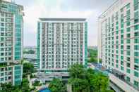 Bangunan Comfy and Best Strategic Studio Apartment at Woodland Park Residence By Travelio