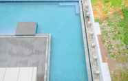 Swimming Pool 6 Comfy and Modern Look 2BR at Vasaka Solterra Apartment By Travelio