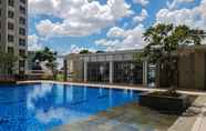 Swimming Pool 6 Modern Look and Comfort 2BR Apartment M-Town Signature By Travelio