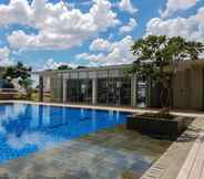 Swimming Pool 6 Modern Look and Comfort 2BR Apartment M-Town Signature By Travelio