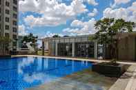 Swimming Pool Modern Look and Comfort 2BR Apartment M-Town Signature By Travelio