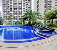 Swimming Pool 7 Modern Look and Comfort 3BR Sky House BSD Apartment By Travelio