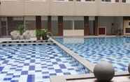 Swimming Pool 4 Studio Best Deal at Emerald Towers Apartment By Travelio