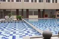 Swimming Pool Studio Best Deal at Emerald Towers Apartment By Travelio