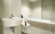 In-room Bathroom 5 Comfy and Modern Look 2BR Vasanta Innopark Apartment By Travelio