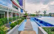 Swimming Pool 6 2BR Comfort Designed at Green Pramuka City Apartment By Travelio