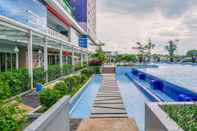 Swimming Pool 2BR Comfort Designed at Green Pramuka City Apartment By Travelio