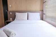 Kamar Tidur 1BR Homey Apartment at The Edge Bandung By Travelio