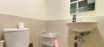 In-room Bathroom 5 Comfortable Design 2BR with Working Space at Meikarta Apartment By Travelio