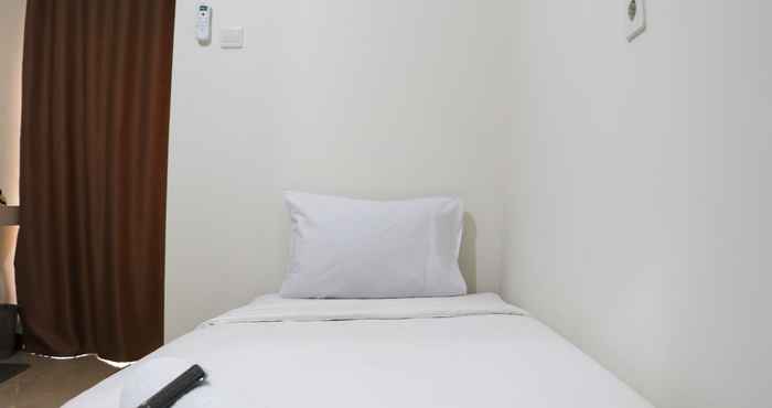 Kamar Tidur Nice and Fancy Studio at Loftvilles City Apartment By Travelio