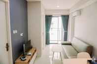 Common Space Comfort 1BR Apartment with Working Room at Daan Mogot City By Travelio