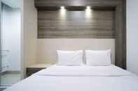 ห้องนอน Homey Studio Apartment at Tamansari Papilio By Travelio