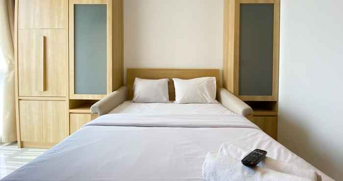 Bedroom Homey and Modern Design Studio Ciputra World 2 Apartment By Travelio