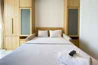 Bedroom Homey and Modern Design Studio Ciputra World 2 Apartment By Travelio