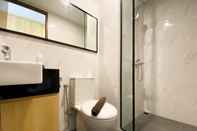 In-room Bathroom Homey and Modern Design Studio Ciputra World 2 Apartment By Travelio