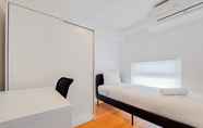 Bedroom 2 Elegant and Spacious 3BR Loft at Kingland Avenue Apartment By Travelio