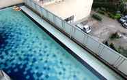 Swimming Pool 6 Cozy and Homey 2BR Apartment at Tamansari Panoramic By Travelio