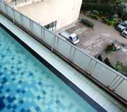 Swimming Pool 6 Cozy and Homey 2BR Apartment at Tamansari Panoramic By Travelio