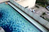 Swimming Pool Cozy and Homey 2BR Apartment at Tamansari Panoramic By Travelio