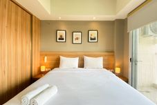 Bedroom Elegant and Spacious Studio Apartment Mustika Golf Residence By Travelio