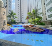 Swimming Pool 7 Homey and Full Furnished 2BR Bassura City Apartment near Mall By Travelio