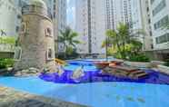 Swimming Pool 7 Homey and Full Furnished 2BR Bassura City Apartment near Mall By Travelio