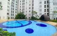 Kolam Renang 7 Strategic and Comfort Living 2BR at Bassura City Apartment By Travelio