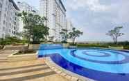 Kolam Renang 6 Strategic and Comfort Living 2BR at Bassura City Apartment By Travelio