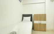 Bedroom 2 Strategic and Comfort Living 2BR at Bassura City Apartment By Travelio