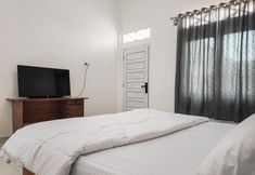 침실 2 Adela Homestay Syariah Near Universitas Muhammadiyah Jambi Mitra RedDoorz