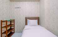 Bedroom 2 Tidy and Comfortable 2BR Lagoon Apartment By Travelio