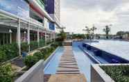 Swimming Pool 6 Comfort Stay 2BR Apartment at Green Pramuka City By Travelio