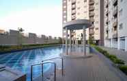 Kolam Renang 7 Homey and Best Choice 2BR at Puncak Dharmahusada Apartment By Travelio