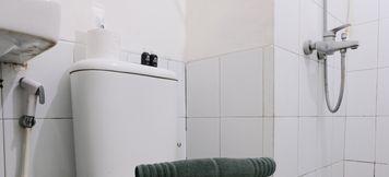 In-room Bathroom 5 Comfy and Good Deal 2BR at Grand Asia Afrika Apartment By Travelio