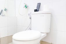 In-room Bathroom Modern and Best Deal 2BR Bassura City Apartment By Travelio