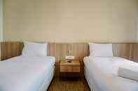 Kamar Tidur Homey and Cozy Studio Great Western Resort Apartment By Travelio