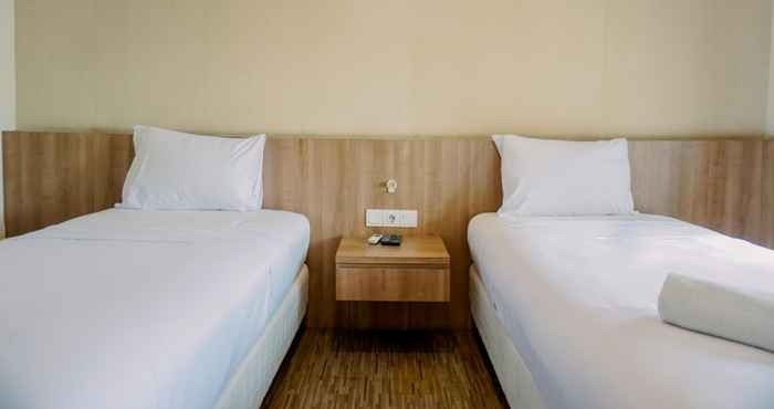 Kamar Tidur Homey and Cozy Studio Great Western Resort Apartment By Travelio