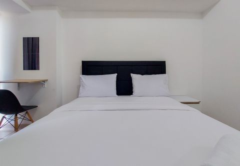 Bedroom Elegant and Homey Studio Apartment M-Town Residence By Travelio