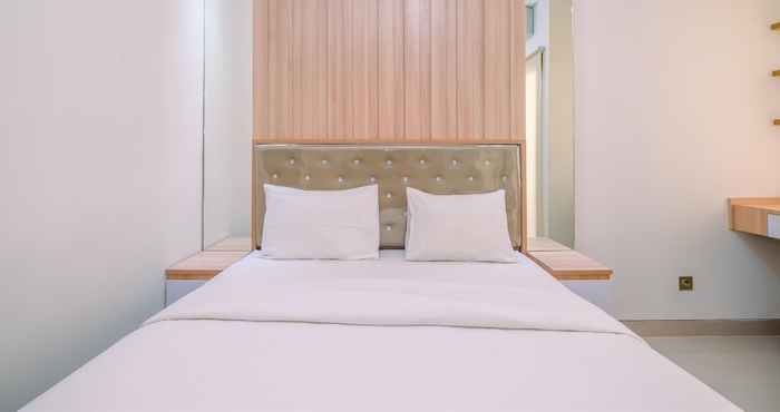 Bedroom Homey and Cozy Living Studio Transpark Cibubur Apartment By Travelio