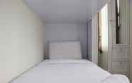Bedroom 2 Comfort 2BR at 30th Floor Transpark Cibubur Apartment  By Travelio