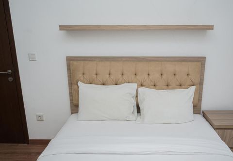 Kamar Tidur Simply and Comfortable 1BR at M-Town Signature Apartment By Travelio